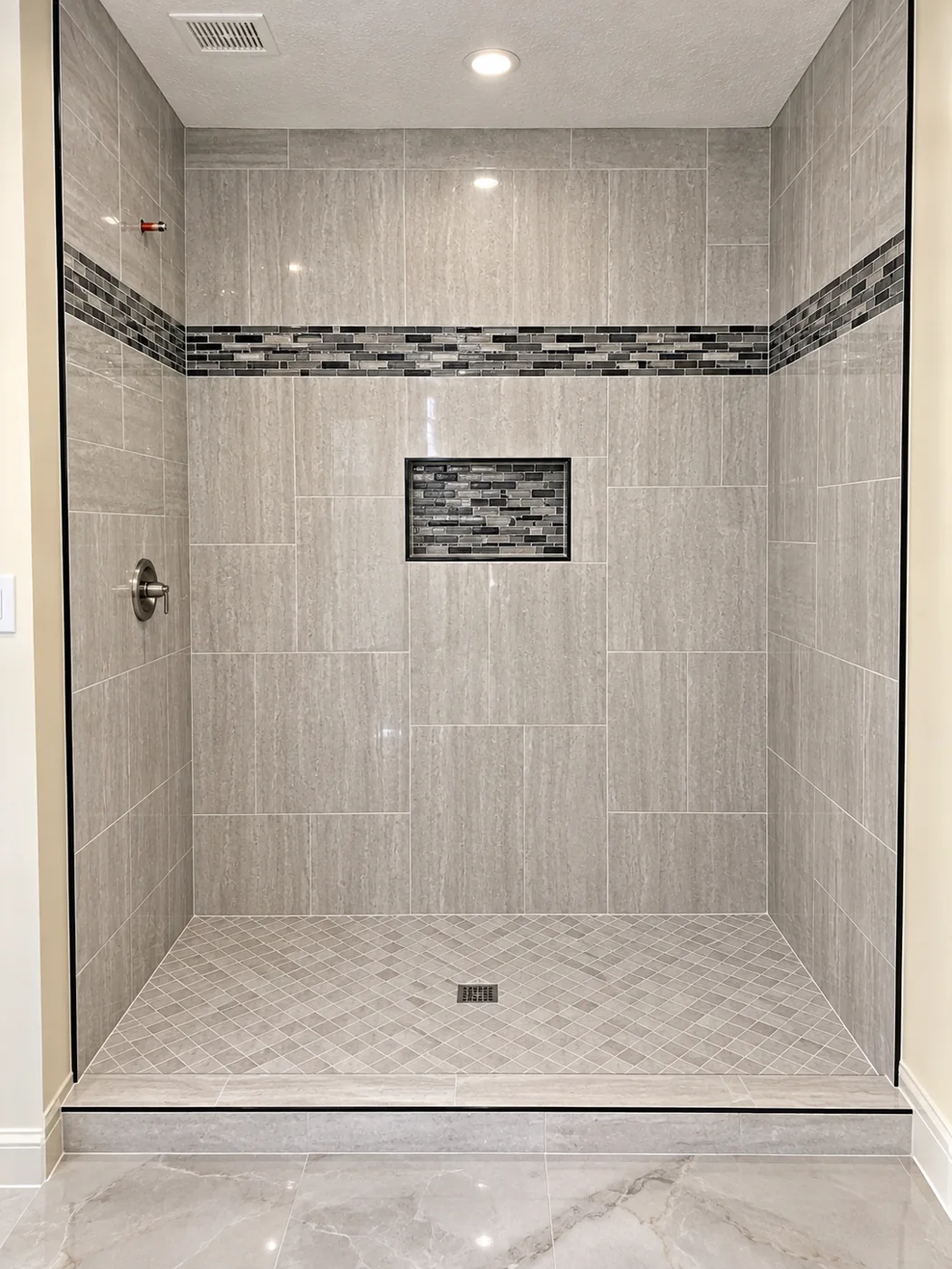 Walk-In Tile Shower: Mosaic accent band, recessed niche and tiled shower floor