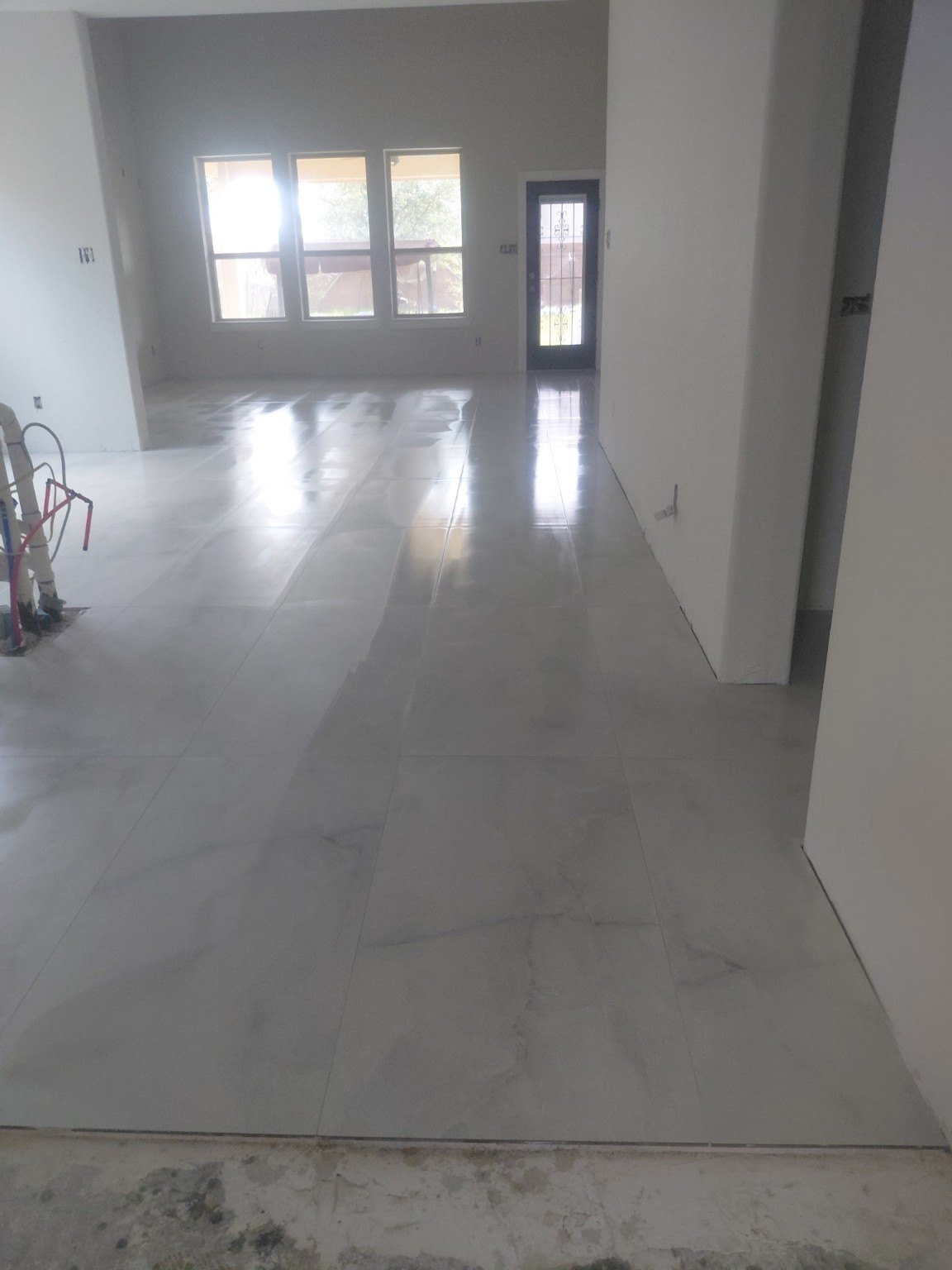 Large format floor tile installation